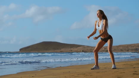 Sportswoman-Wearing-Sportswear-Doing-Squats-Exercise-Outdoors.-Fitness-Female-Working-Out-on-the-Beach-at-Sunset.-Athletic-Young-Woman-is-Engaged-in-Outdoor-Sports.